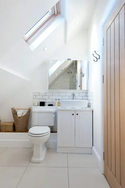 Built-in storage and wall niches featured in a smart Small Bathroom Renovations by Bathroom Renovations West Auckland.
