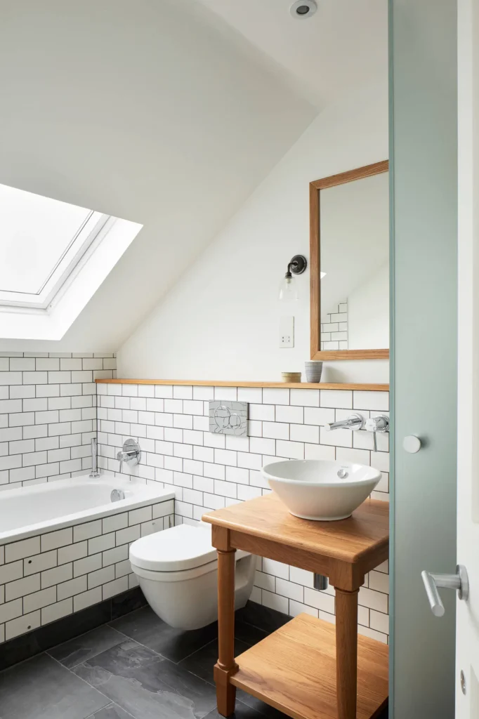 Bright lighting and clean design making a Small Bathroom Renovations feel spacious by Bathroom Renovations West Auckland.